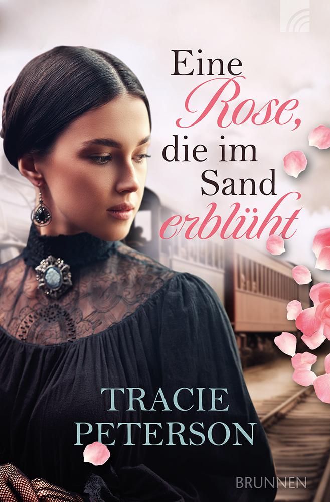 Eine Rose, die im Sand erblüht